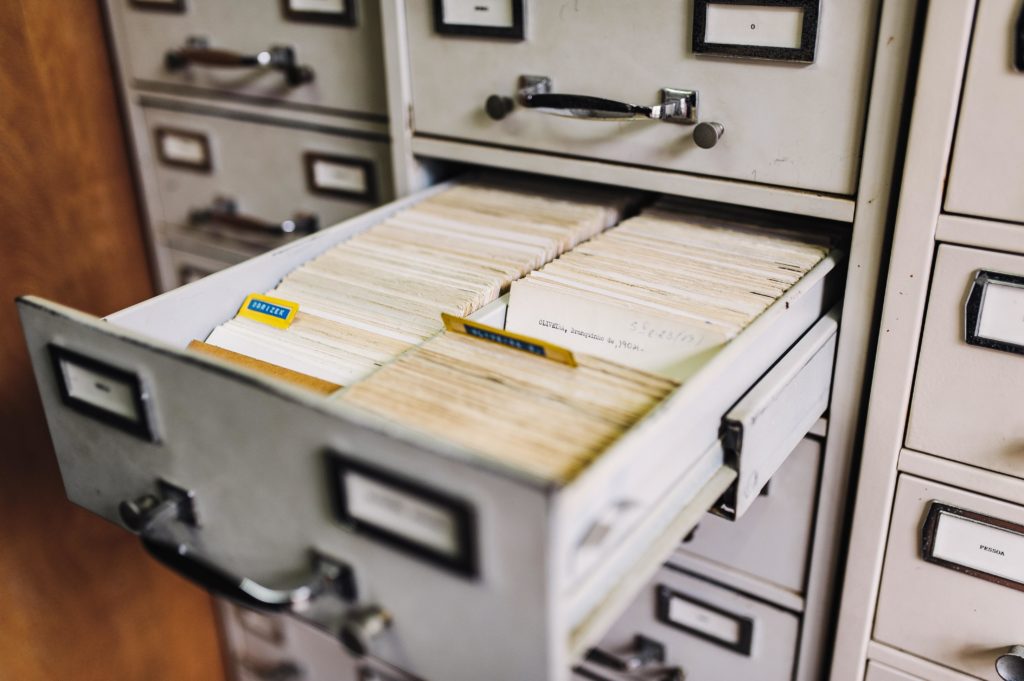A card catalog with two open drawers