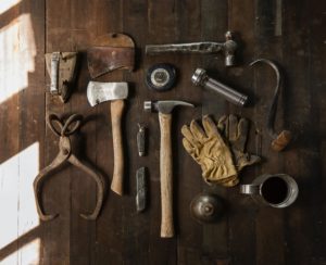 Old timey construction tools shown from above, representing how to build an SEO foundation with Good Content