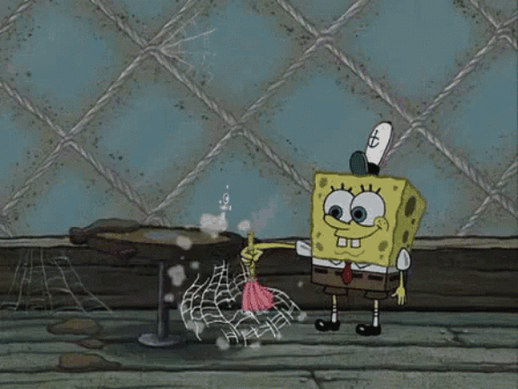 A Gif of Spongebob Squarepants dusting a table that has a spider and cobwebs on it.